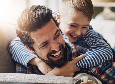 Buy stock photo Father, child and hug in house for bonding with family, learning and development for youth wellness. Dad, son and happiness in home with love and care relationship, embrace on sofa for healthy relax