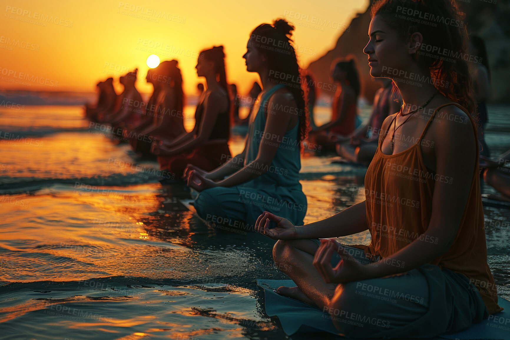 Buy stock photo Women, beach and calm meditation for peace or spiritual growth, emotional balance and mindfulness for mental health. People, eyes closed and breath with sunset for zen outdoor, lotus pose and chakra.