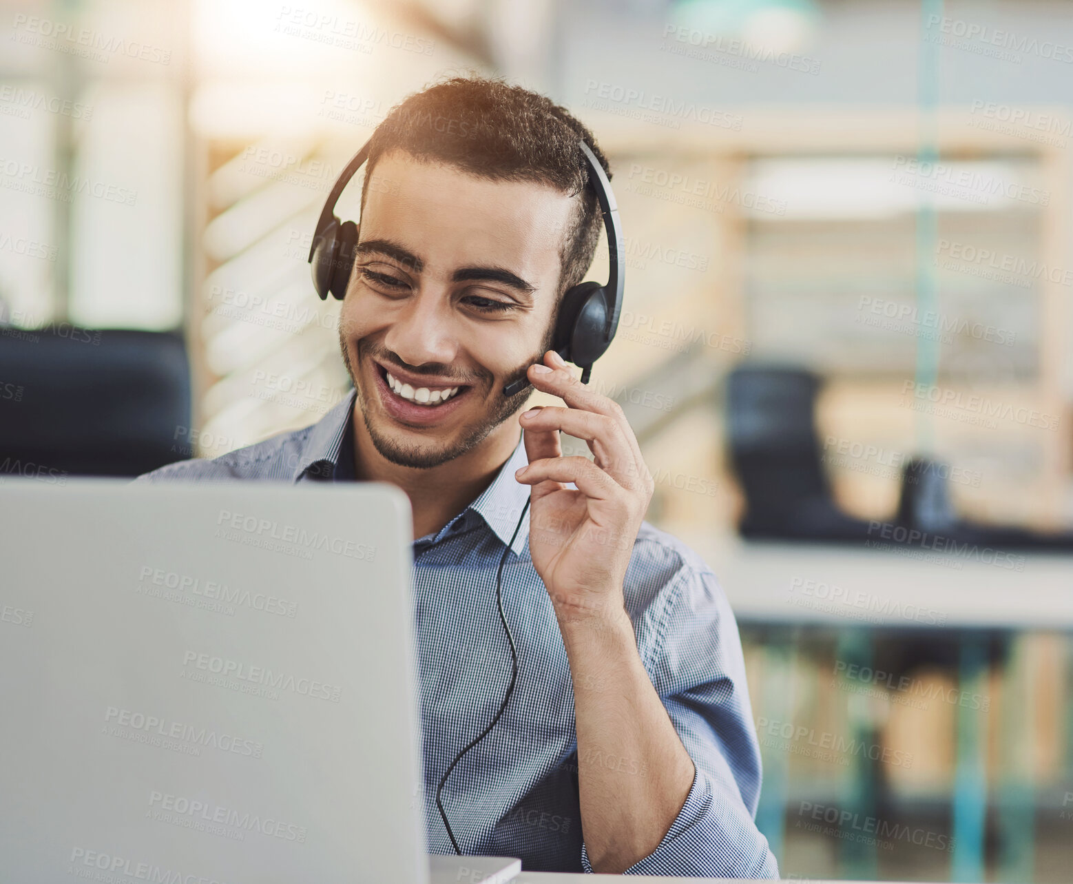 Buy stock photo Shot of a young call centre agent working in an office