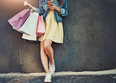 Buy stock photo Cropped shot of an unrecognizable woman on a shopping spree in the city
