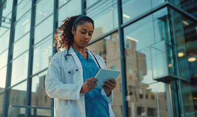 Healthcare, doctor and woman with tablet for research, medical info or results as specialist. Female person, technology or surgeon for diagnosis, treatment or working with Telehealth in hospital