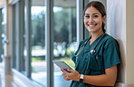 Medical, portrait and tablet with nurse woman in hospital lobby for research or treatment. Healthcare, smile and technology with happy medicine professional in clinic for cardiology or consulting