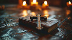 Bible, cross and candles for Christianity religion with knowledge, information and healing for faith. Church, holy book and verse or text for revelation, wisdom and guidance with gospel for life