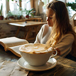 Coffee, book and woman in cafe for reading story with relax, morning and weekend activity. Cappuccino, gen z female student and fiction in restaurant with studying for test, education and knowledge