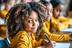 Black child, portrait and classroom with friends for learning education in kindergarten, writing or desk. Girl, face and smile as young student for english lesson or or school, future or elementary