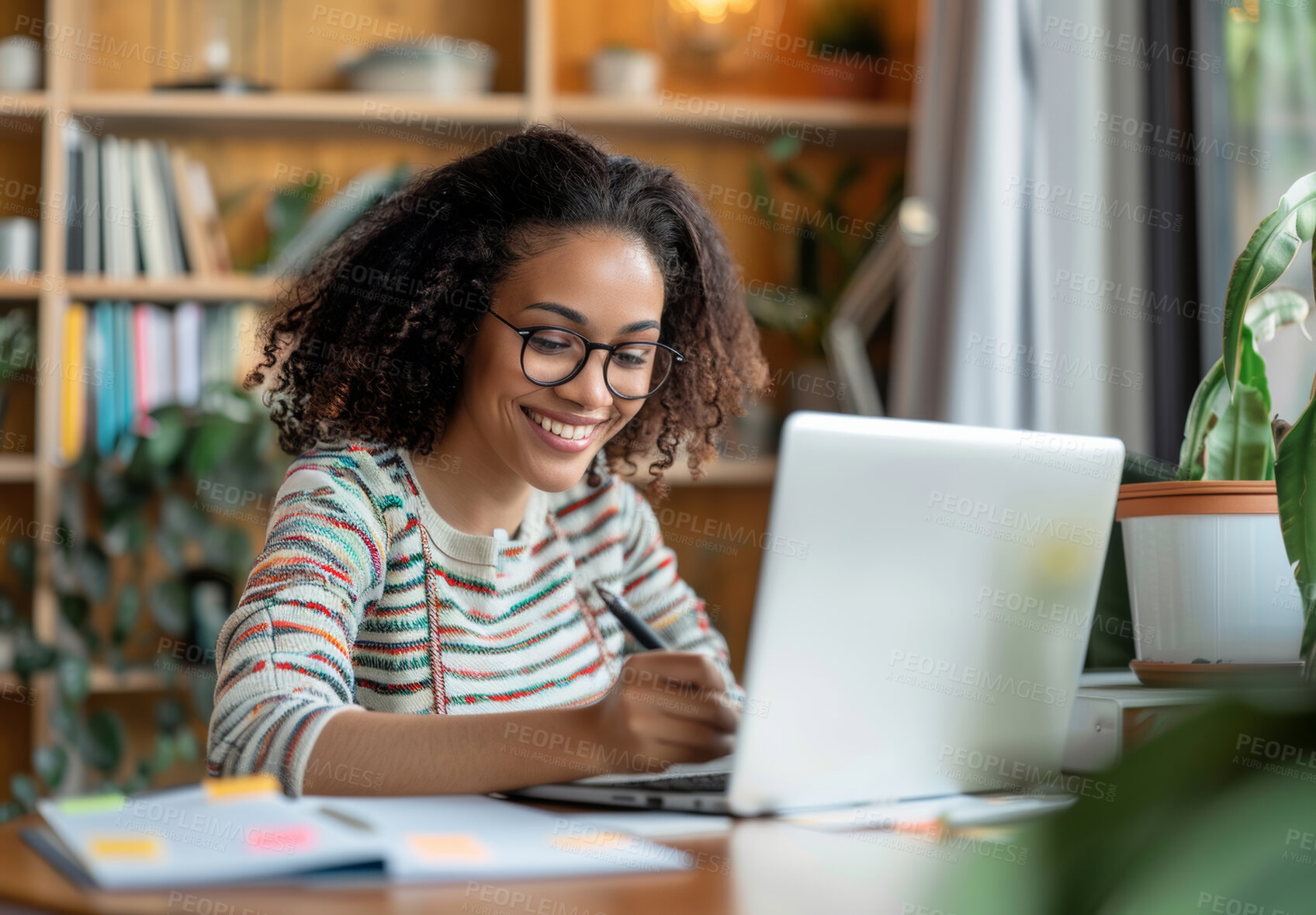 Buy stock photo Laptop, notes and woman student writing in library studying for university exam, assignment or test. Smile, technology and female person work on college project with computer in classroom at campus.