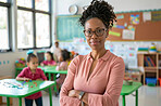 Kindergarten, kids and portrait of teacher with arms crossed for child development, lesson and support. Class, black woman and smile with pride by students for teaching, future or career in education