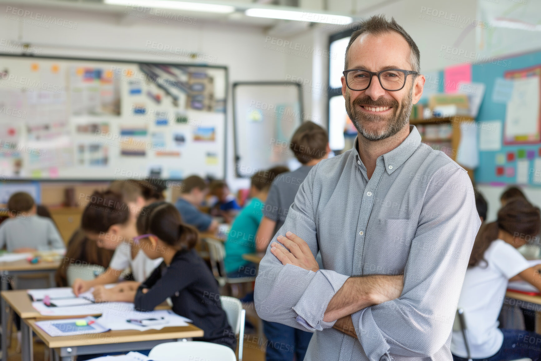 Buy stock photo Kids, classroom and portrait of teacher with arms crossed for lesson, support or child development. Students, mature man and smile with pride at school for teaching, leadership or career in education