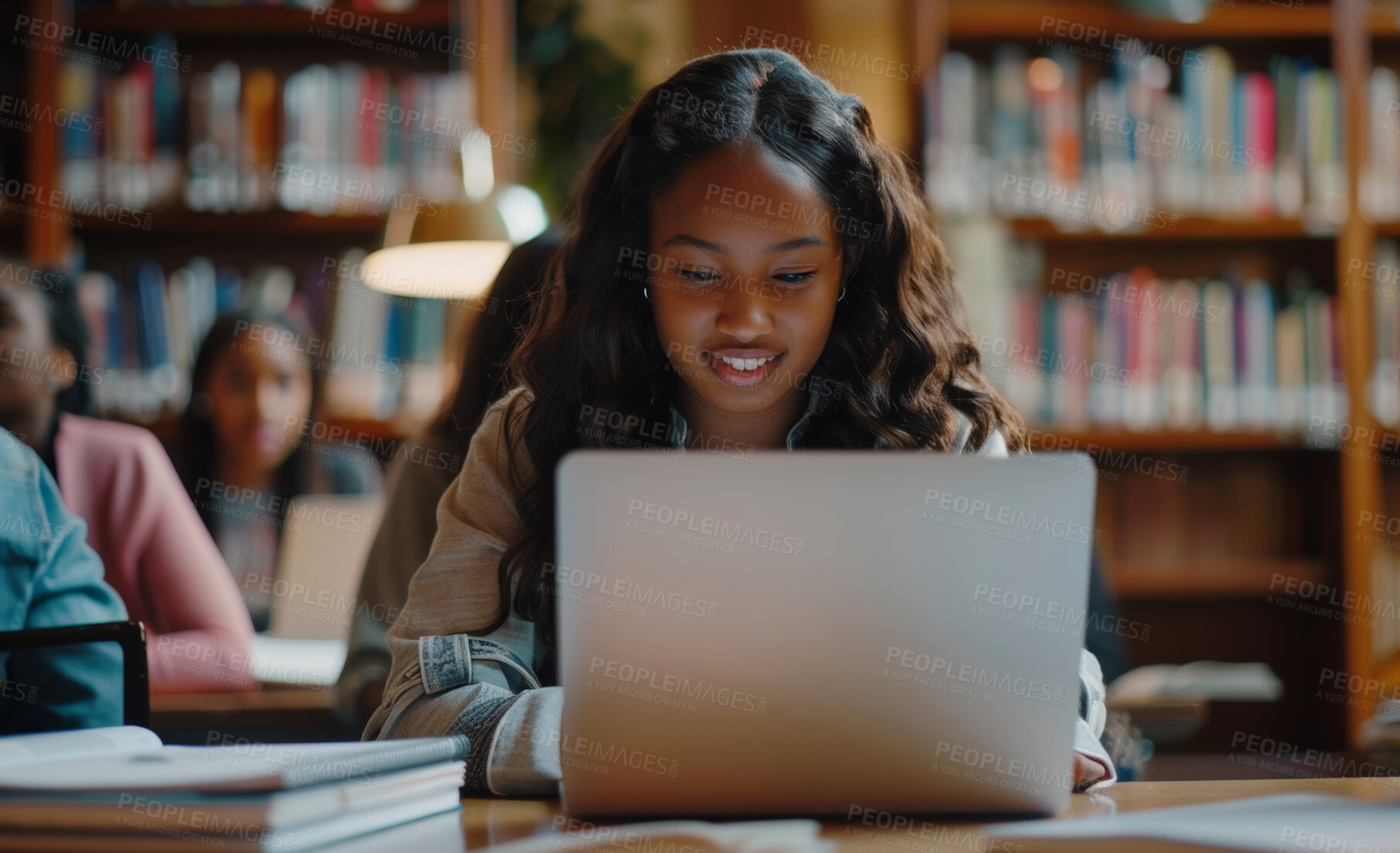 Buy stock photo Computer, research and woman in library for studying and read for university exam, assignment or test. Smile, technology and female student work on college project with laptop in classroom at campus.