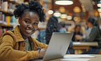 Laptop, education and woman studying in library reading for university exam, assignment or test. Smile, technology and female student working on college project with computer in classroom at campus.