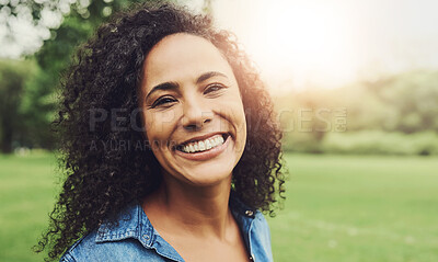 Buy stock photo Portrait of a beautiful young woman in a public park