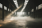 Empty warehouse, abandoned and sunlight with smoke for real estate, manufacturing and building for storage. Industrial property, sunshine and dust or vapor for horror with nightmare, scary and danger