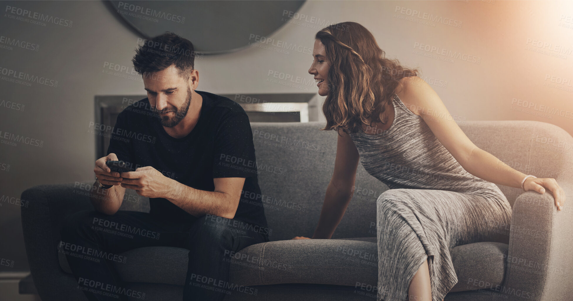 Buy stock photo Couple, phone and spy for relationship, cheating and trust with toxic partner in house on sofa. Man, smartphone and peep for affair, jealous and jealous with paranoid girlfriend in home on couch