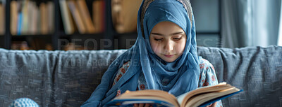 Buy stock photo Muslim, faith and kid reading Quran in home on sofa for religion or worship on EID in living room. Islam, girl and child study book for learning, education or spiritual knowledge on ramadan mubarak