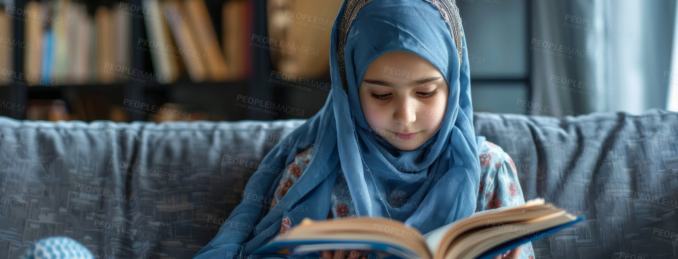 Buy stock photo Muslim, faith and kid reading Quran in home on sofa for religion or worship on EID in living room. Islam, girl and child study book for learning, education or spiritual knowledge on ramadan mubarak