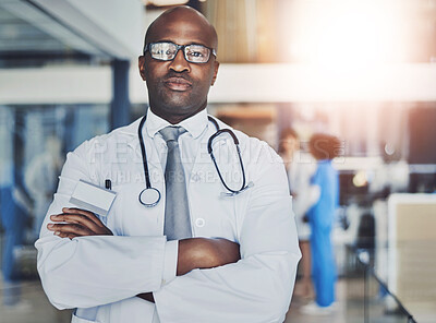 Buy stock photo Doctor, pride and confidence in hospital for healthcare, wellness or medical experience with stethoscope. Black man, face and portrait in health facility with crossed arms for cardiology or medicine