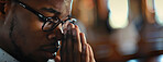 Face, black man and temple with praying as Christian for salvation, hope and worship with faith. Religion, healing and respect with praise for guidance, protection and spirituality for connection