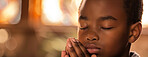 Boy, prayer and faith for religion, church or cathedral for hope or spirituality. African kid, hands and worship for gratitude, forgiveness and holy gospel for God or Jesus Christ with Christianity