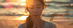 Woman, peace and beach with praying at sunset for spiritual, worship in nature for Jesus. Female person, calm and ocean with hands for God or hope in banner, faith and mindfulness with prayer