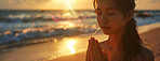 Woman, peace and beach with prayer at sunset for spiritual, worship in nature for Jesus. Female person, calm and ocean with hands for God or hope in banner, faith and mindfulness with praying