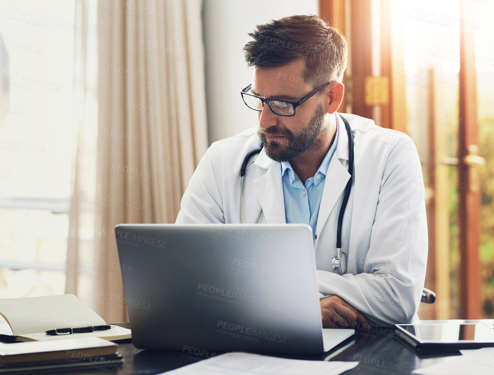 Buy stock photo Man, doctor and laptop with research, ideas and thinking in clinic as medical professional. Male person, pediatrician and diagnosis, telehealth and technology for patient records, medicine or surgery