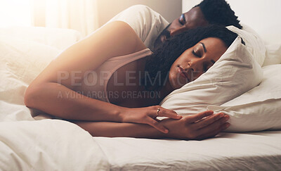 Buy stock photo Cropped shot of a young attractive couple sleeping in bed at home