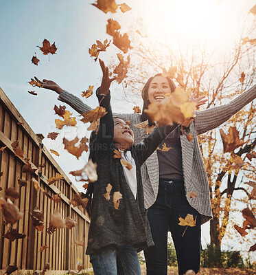 Buy stock photo Asian, woman and child in outdoor, park or garden with enjoying autumn, playing and fun for bonding. Female person, girl and together as mother and daughter family on weekend, break or relax in Japan