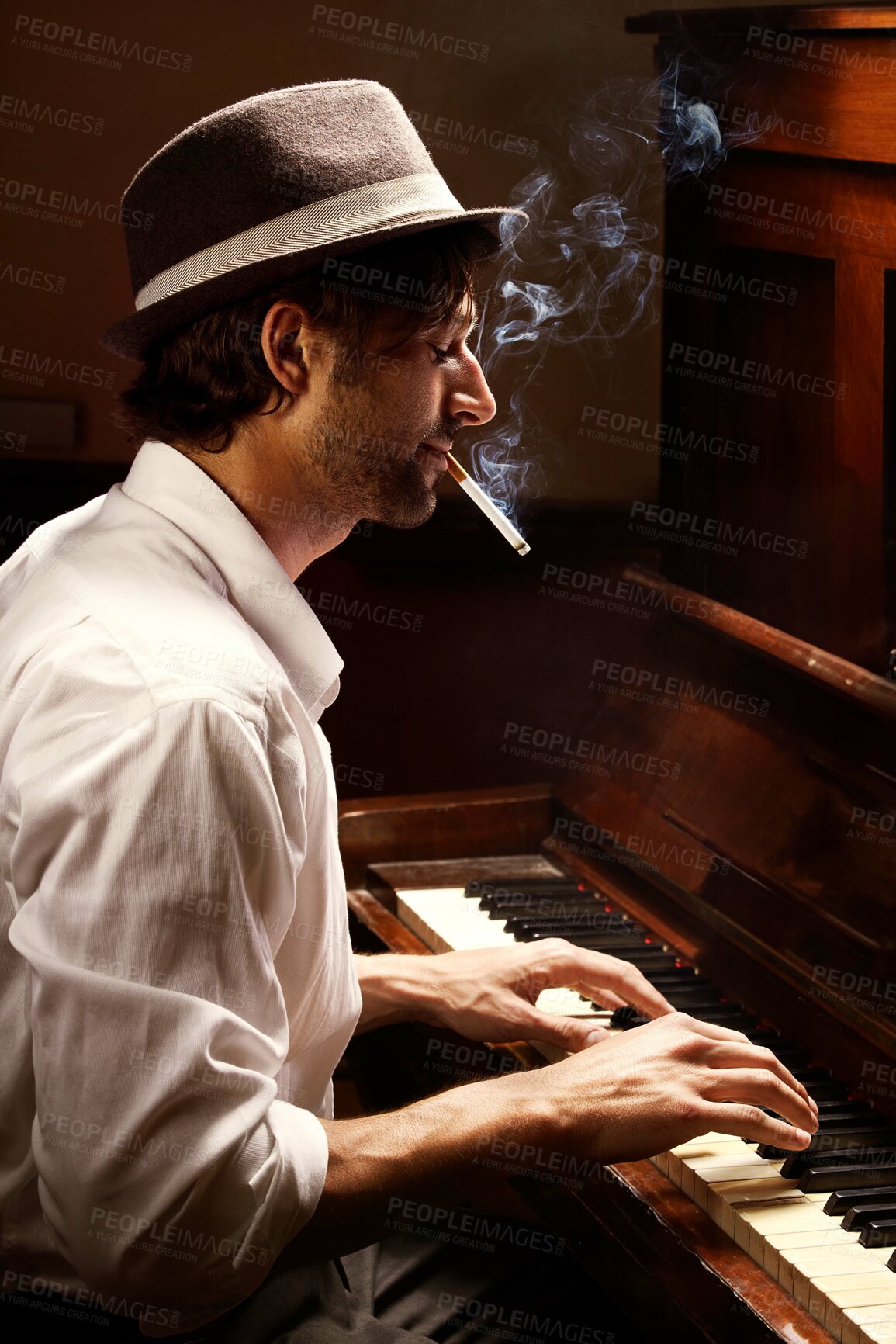 Buy stock photo Profile, piano and man with performance, smoking and entertainment with keyboard, jazz and creative. Person, artist and musician with cigarette, tobacco and ambient with smoke, pianist and instrument