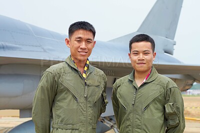 Buy stock photo A shot of two confident asian fighter pilots