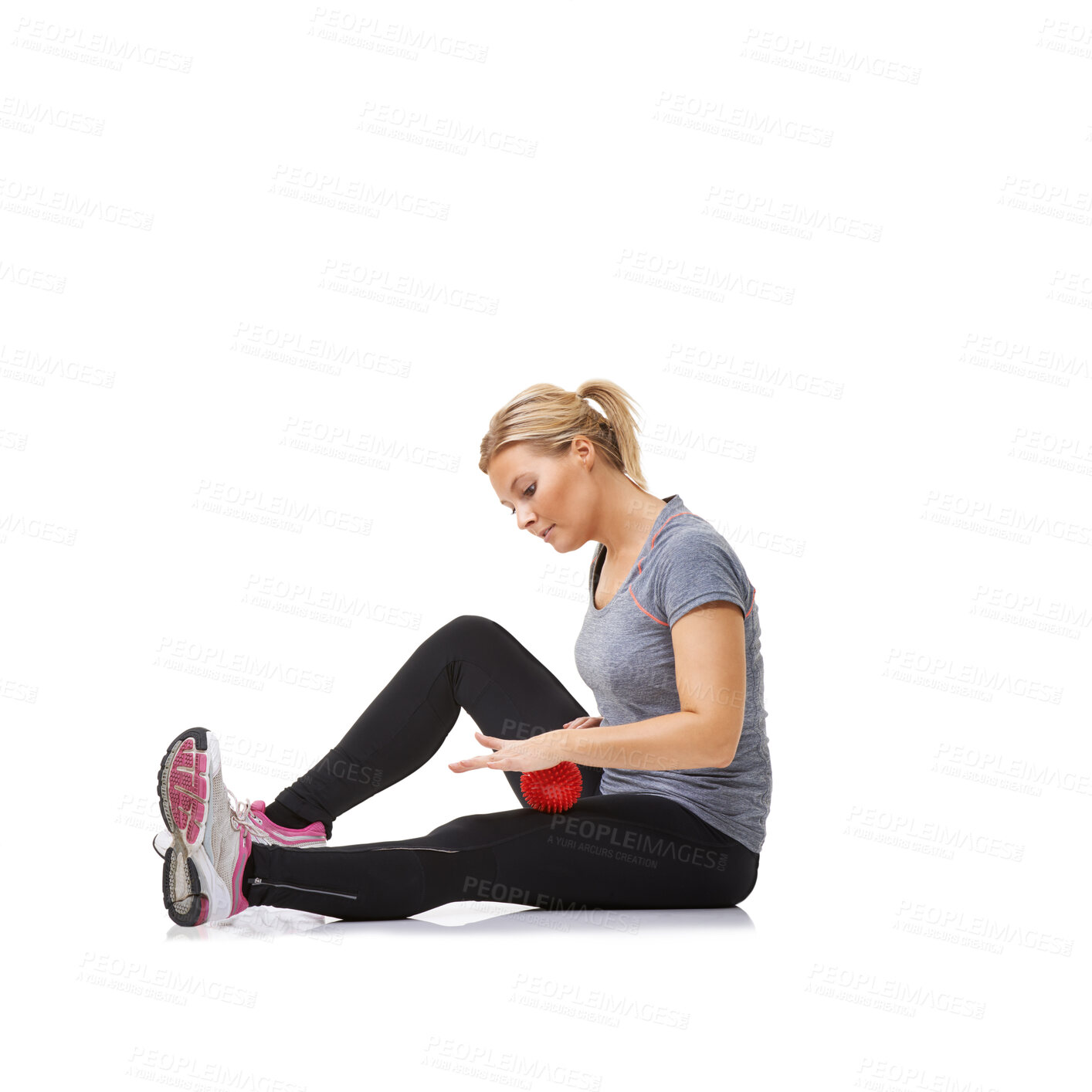 Buy stock photo A young woman getting in shape using an exercise ball