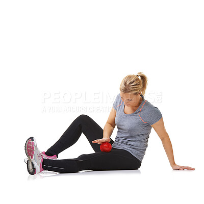 Buy stock photo Woman, massage ball and healing body or rehabilitation, injury and health or wellness by white background. Female person, athlete and physical therapy in studio for muscles in legs and body in mockup