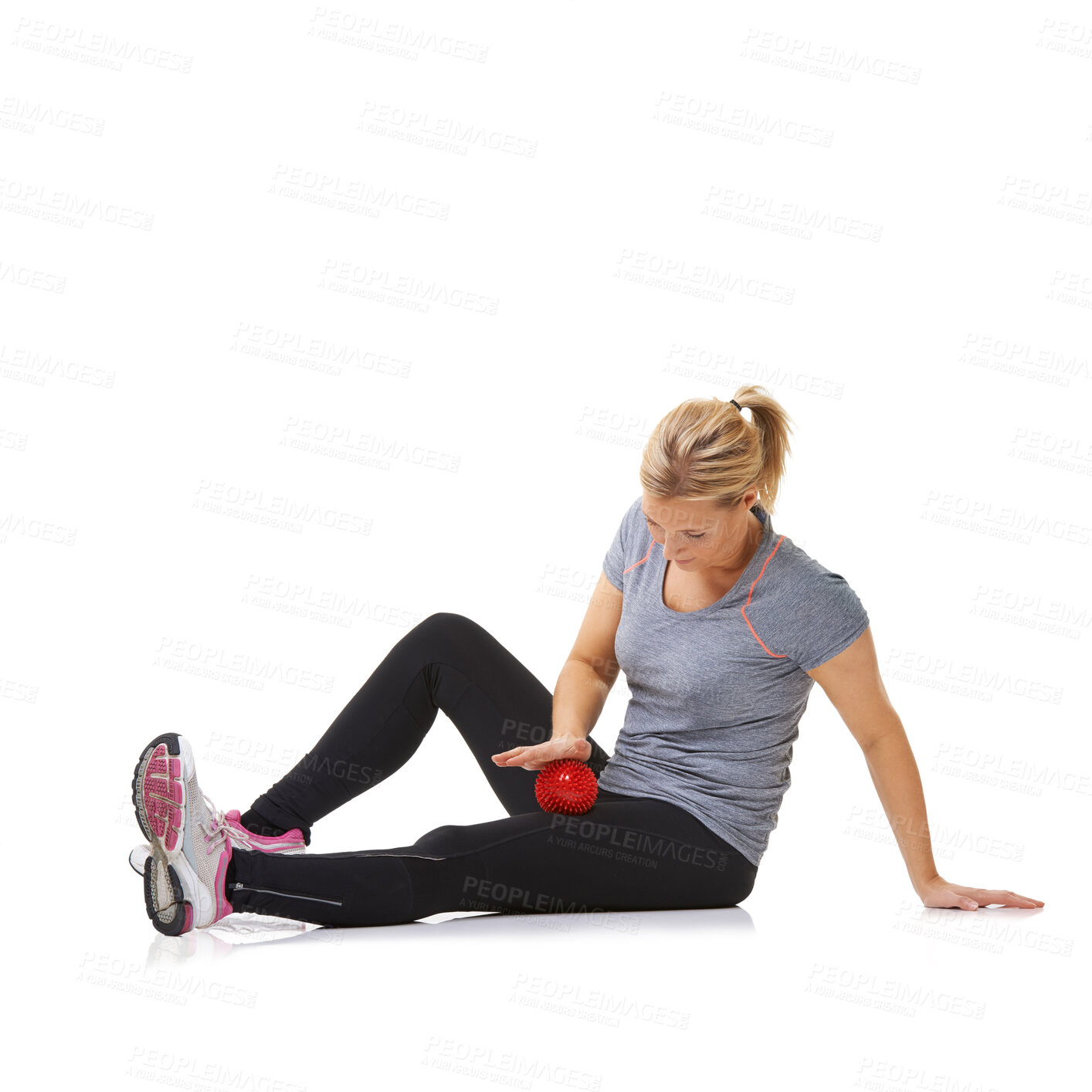 Buy stock photo Woman, massage ball and healing body or rehabilitation, injury and health or wellness by white background. Female person, athlete and physical therapy in studio for muscles in legs and body in mockup