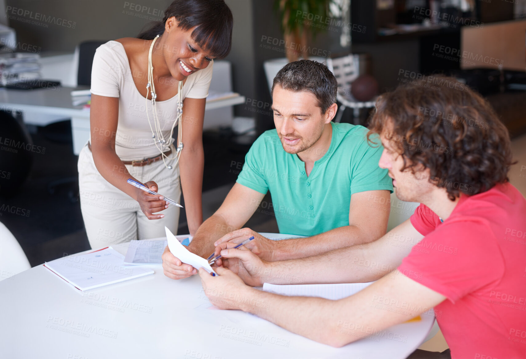 Buy stock photo Diversity, colleagues planning and at desk in a modern workplace office together for support. Collaboration or teamwork, ideas or strategy and coworkers brainstorming or planning at workstation