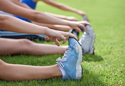 Buy stock photo Stretching legs, sneakers and exercise in park, grass and nature with fitness group for health and wellness. People warm up for workout, training together with hands and shoes on grass outdoor