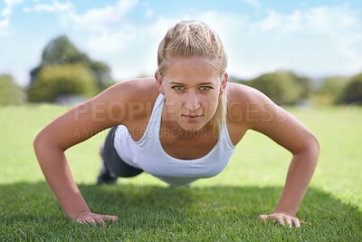 Buy stock photo Women, portrait and push ups on grass for workout with exercise, training and fitness on sports field. Athlete, person and confidence on ground with physical activity for healthy body and wellness