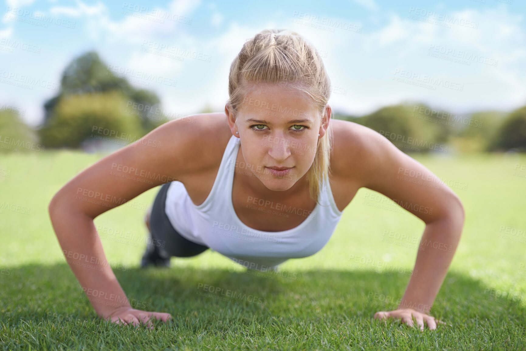 Buy stock photo Women, portrait and push ups on grass for workout with exercise, training and fitness on sports field. Athlete, person and confidence on ground with physical activity for healthy body and wellness