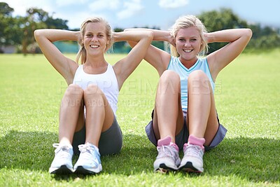Buy stock photo Women, sit ups on grass outdoor for fitness with portrait, smile and wellness with confidence and sportswear. Athlete, friends and collaboration on sports field for physical activity, abdomen or core
