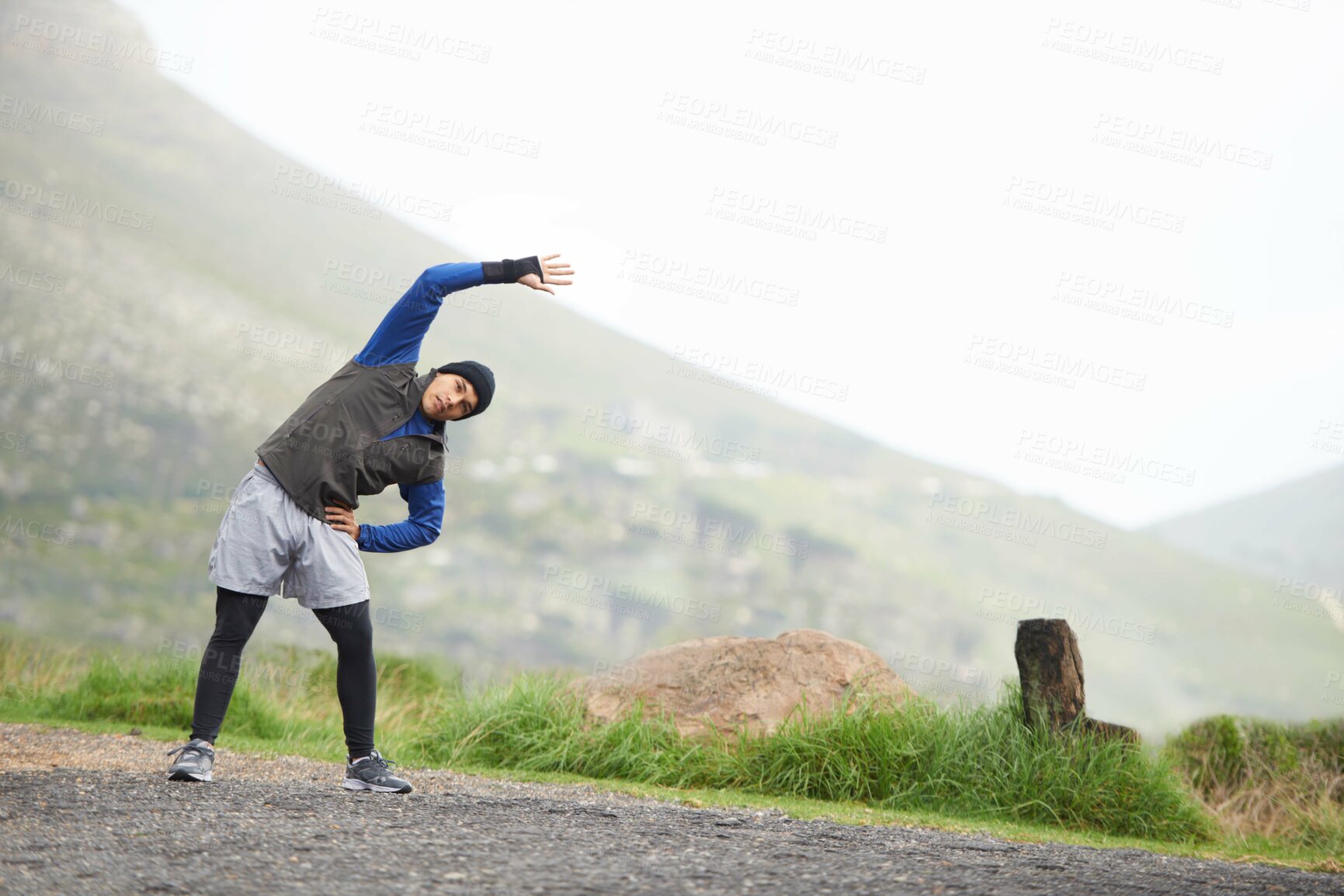 Buy stock photo Man, stretching and start fitness outdoor, mountain and nature with runner and exercise. Workout, training and warm up in road, ready for race or cardio with endurance for health, running and sports