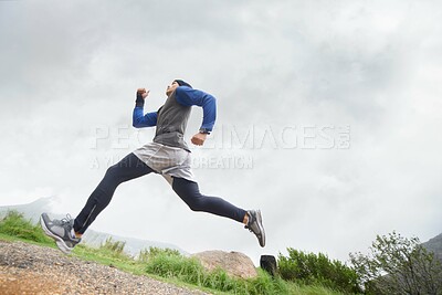 Buy stock photo Fitness, runner and man running in nature training, cardio exercise and endurance workout for wellness. Sports, challenge or healthy male athlete on fast jog on path outdoors with speed or action