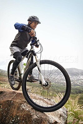 Buy stock photo Man, mountain bike and off road cycling in fitness for nature adventure or outdoor extreme sport. Male person or cyclist on bicycle for cardio, dirt path or speed on cliff in exercise with blue sky