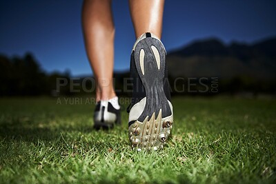 Buy stock photo Person, feet and fitness at night for workout, exercise or outdoor cardio in health and wellness in nature. Closeup of athlete legs, walking or running on green grass in the late evening for training