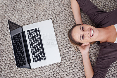 Buy stock photo Woman, laptop and above floor for portrait, smile and relax on break with remote work from home. Person, freelance worker and computer on carpet, rest and happy for blog writing job in apartment