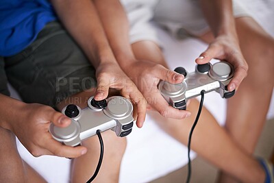 Buy stock photo Children, hands and video game controller in a house for gaming, subscription or entertainment closeup from above. Gamepad, zoom and gamer boy kids at home with esports, competition or challenge