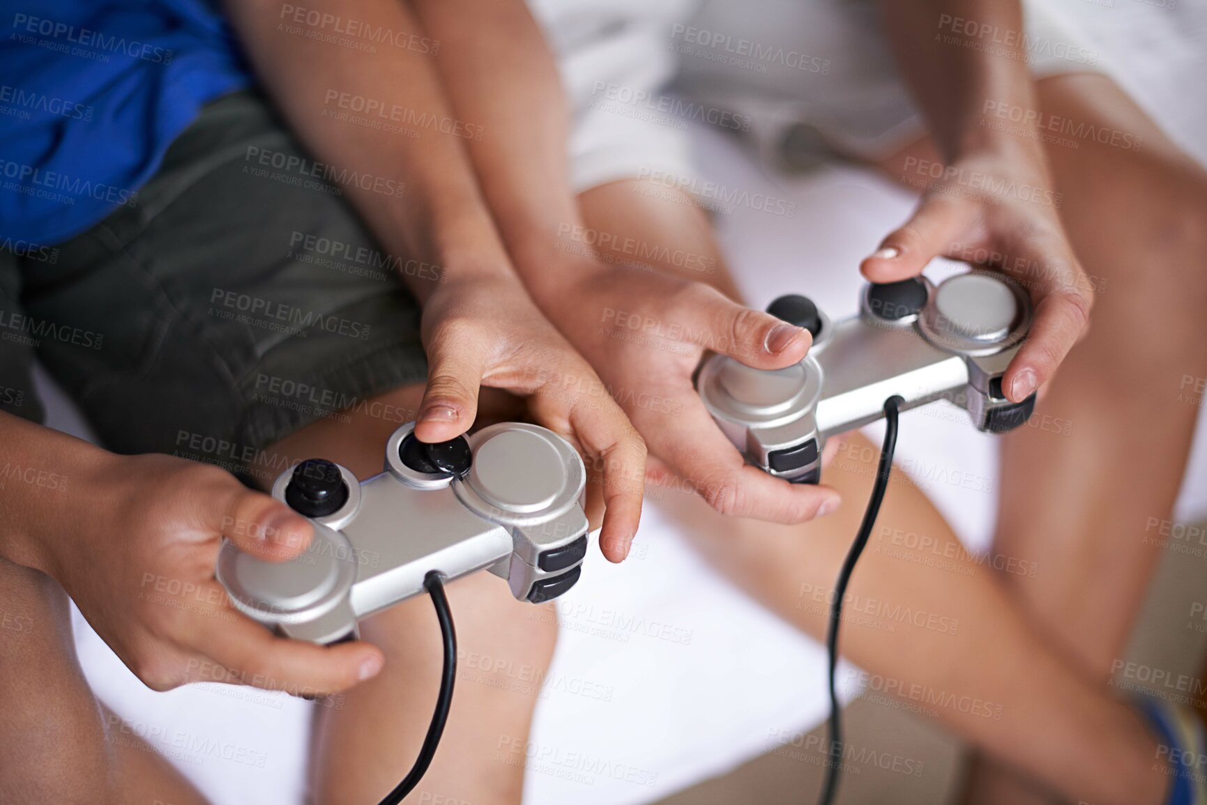 Buy stock photo Children, hands and video game controller in a house for gaming, subscription or entertainment closeup from above. Gamepad, zoom and gamer boy kids at home with esports, competition or challenge