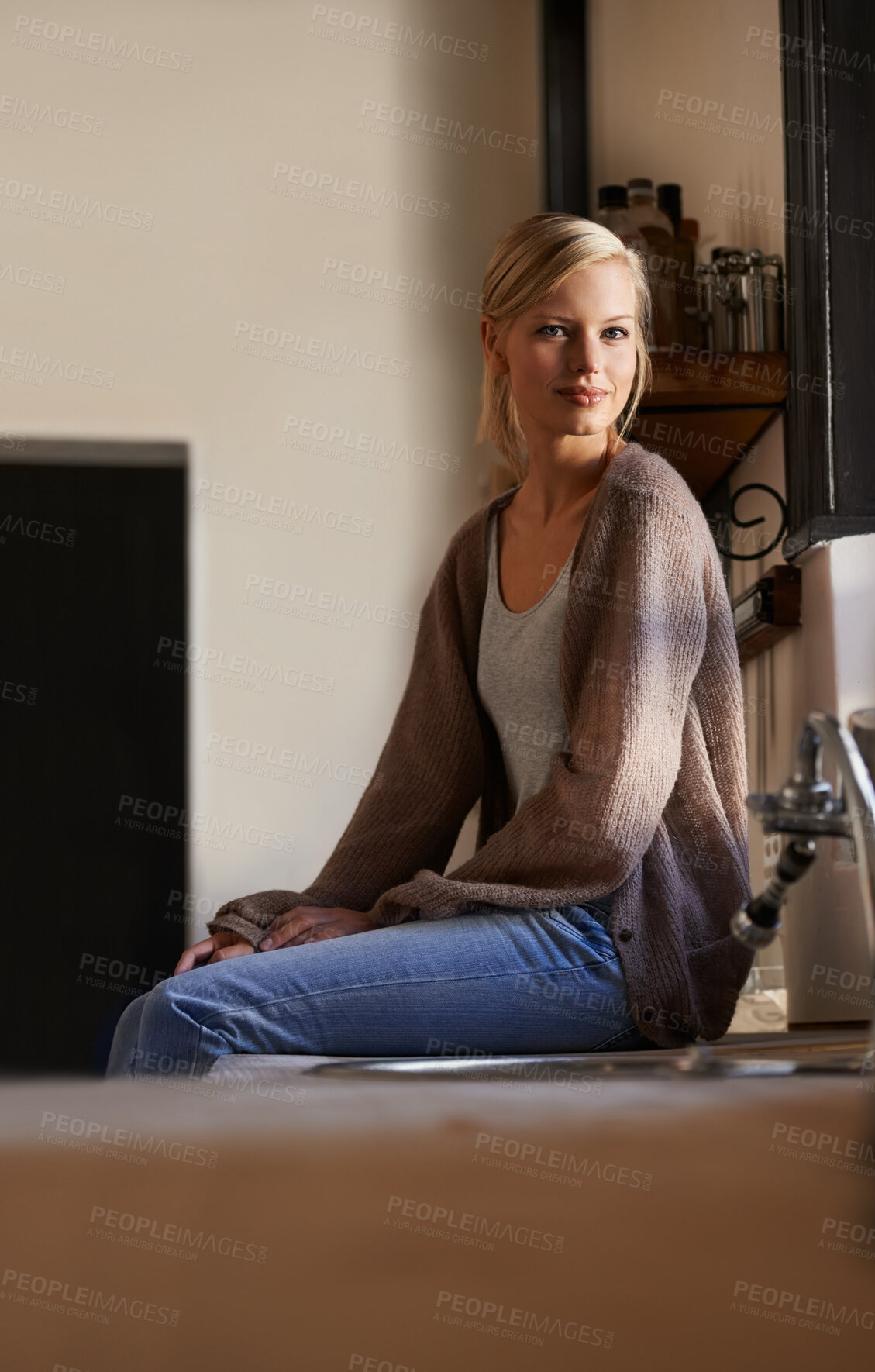 Buy stock photo Portrait, young woman and sitting at home, looking out the window relaxing. Face, smile and happy calm female person, chilling and peaceful on her kitchen counter in a house while positive on weekend