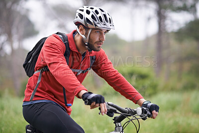 Buy stock photo Health, bike and man cycling on forest field for adventure, discovery or off road sports hobby. Exercise, fitness and wellness with serious young cyclist in nature for cardio training or workout