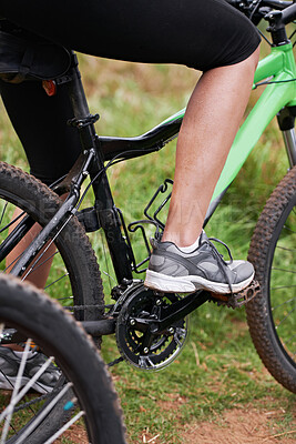 Buy stock photo Person, legs and cyclist with bicycle in nature for paddling, cycling or outdoors sports in health and wellness. Closeup of biker, foot or shoes on mountain bike for off road travel, ride or fitness