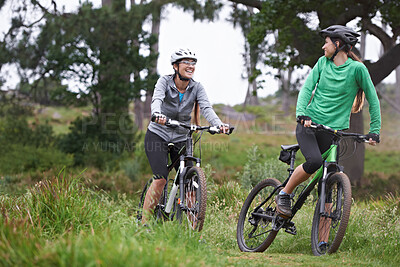 Buy stock photo Happy woman, friends and fitness with bicycle on field for outdoor cycling, workout or cardio exercise in nature. Female person, athlete or cyclist with smile in forest for off road training on trail