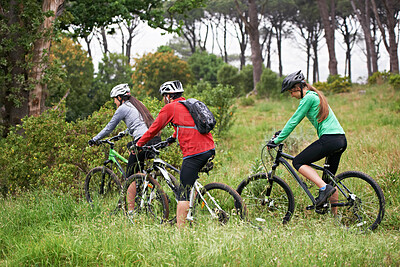 Buy stock photo Cycling, sports and friends in nature for fitness, race and journey with competition or training on path in forest. Group of people or athlete on bicycle for exercise, health and cardio on mountains