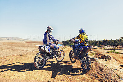 Buy stock photo Rear view, racer or people on motorcycle outdoor on dirt road with relax after driving, challenge and competition. Motocross, motorbike and dirtbike driver with helmet on offroad and path for racing
